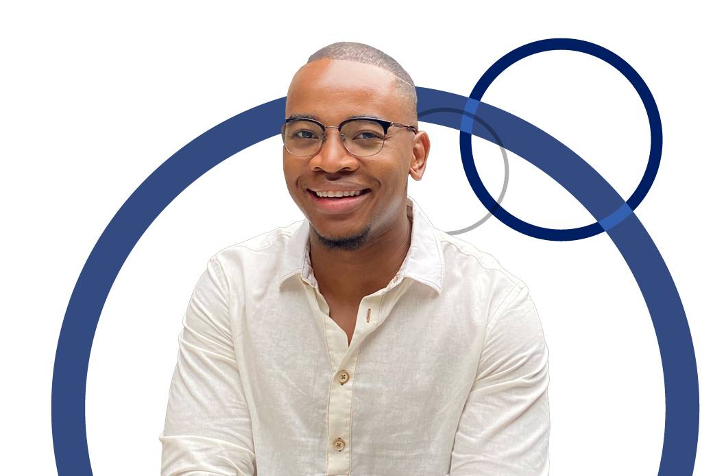 smiling man with circle desi